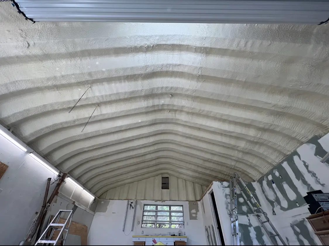 Spray polyurethane foam applied to the underside of a metal roof deck in Boxborough